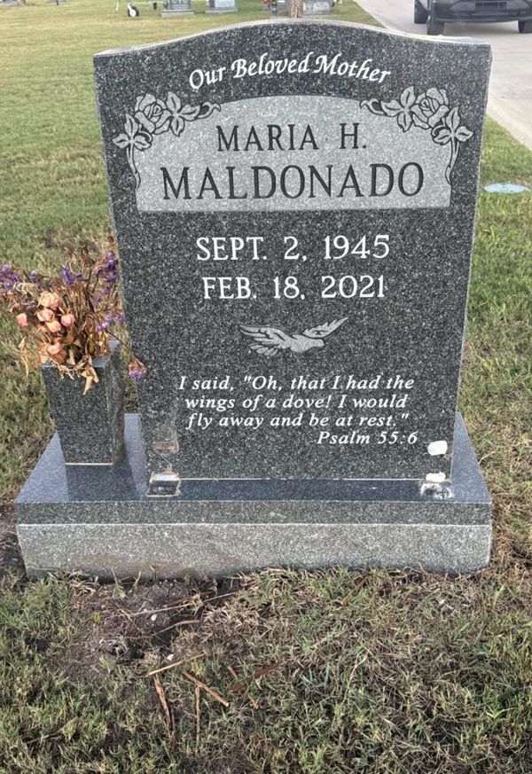 A modern gray granite headstone with clear lettering, photographed during a Turning Hearts field test